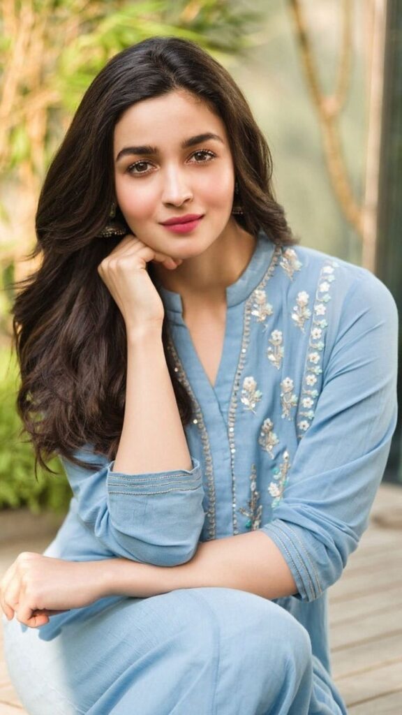 "Aliya Bhatt at a red carpet event, wearing a glamorous outfit."